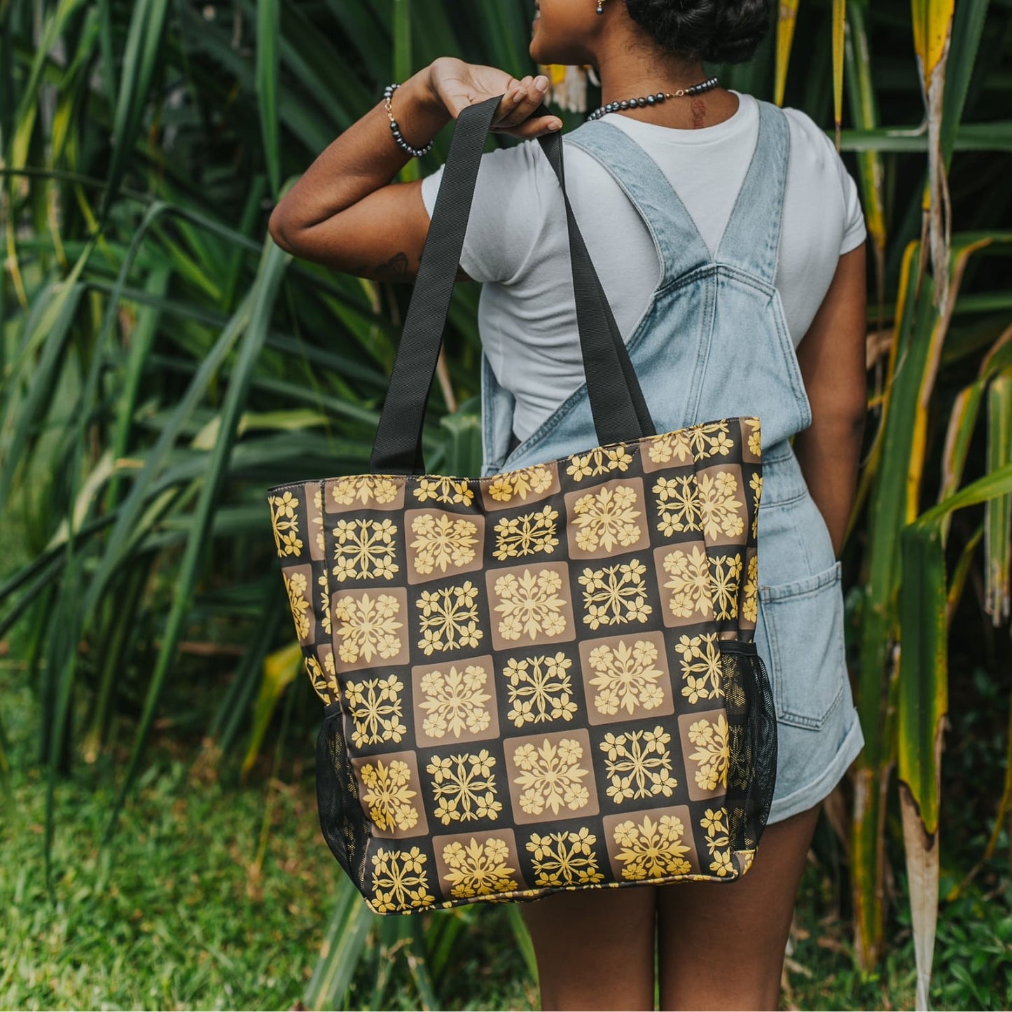 holoholo bag with pua kenikeni flowers - brown and yellow from Puakenikeni Designs model holding