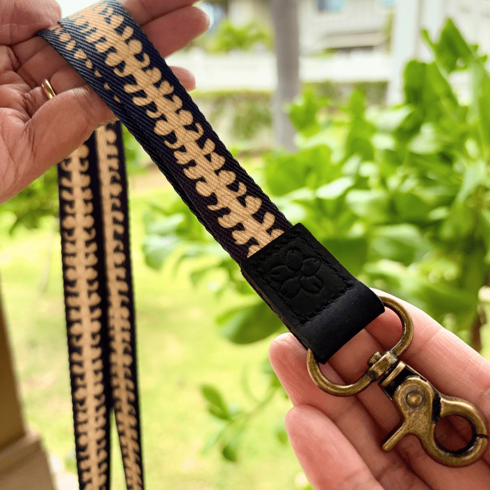 breakaway lanyards for id badges and teachers with beige puakenikeni lei by Puakenikeni Designs close up to lobster clasp