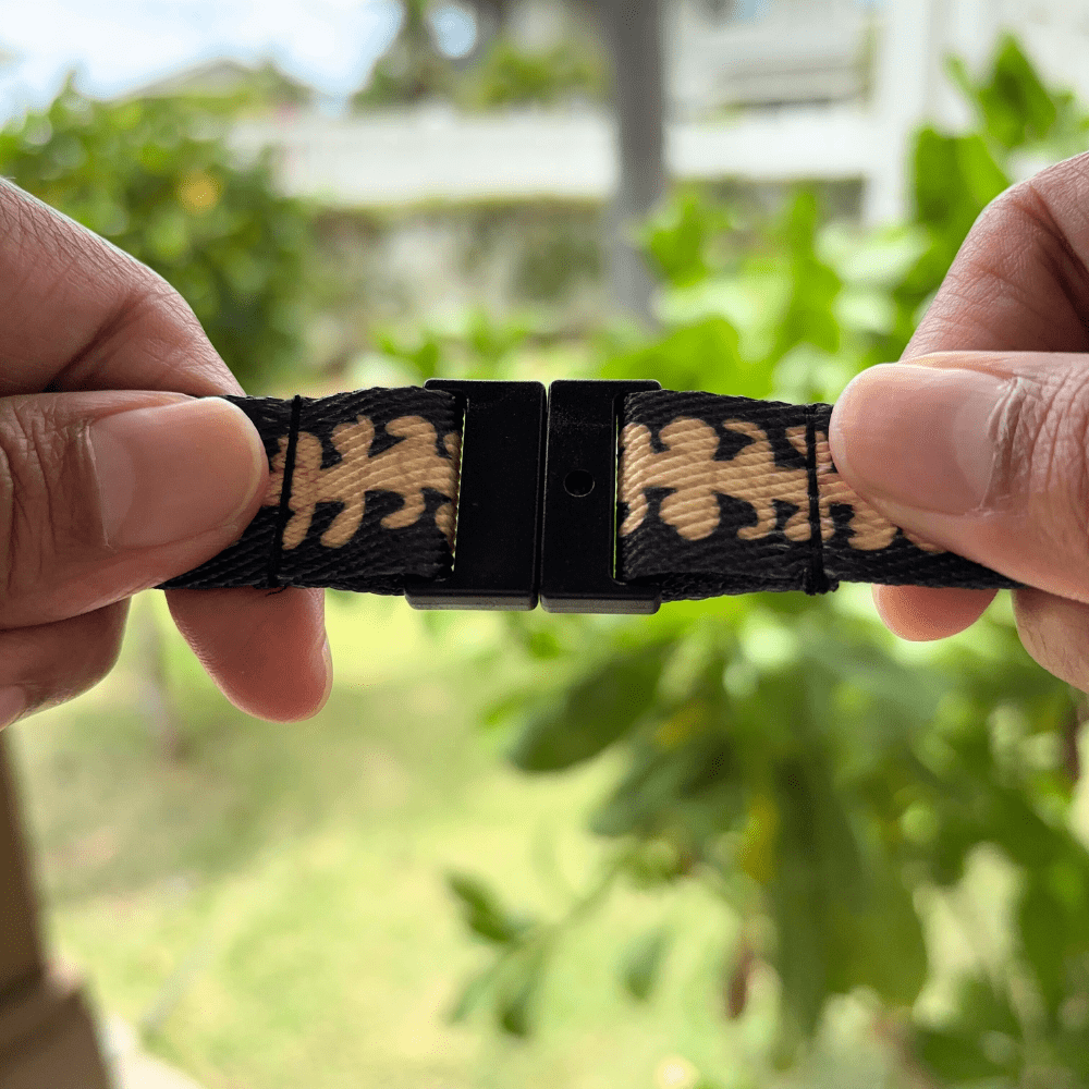 breakaway lanyards for id badges and teachers with beige puakenikeni lei by Puakenikeni Designs close up to safety breakaway clip