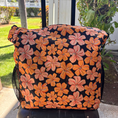 Pua kenikeni Holoholo Bag for travel with crossbody strap from Puakenikeni Designs - use for beach, diaper bag, handbag, hula bag from Puakenikeni Designs on a suitcase