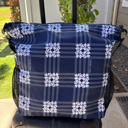 Pua kenikeni Holoholo Bag for travel with crossbody strap from Puakenikeni Designs - use for beach, diaper bag, handbag, hula bag from Puakenikeni Designs on a suitcase